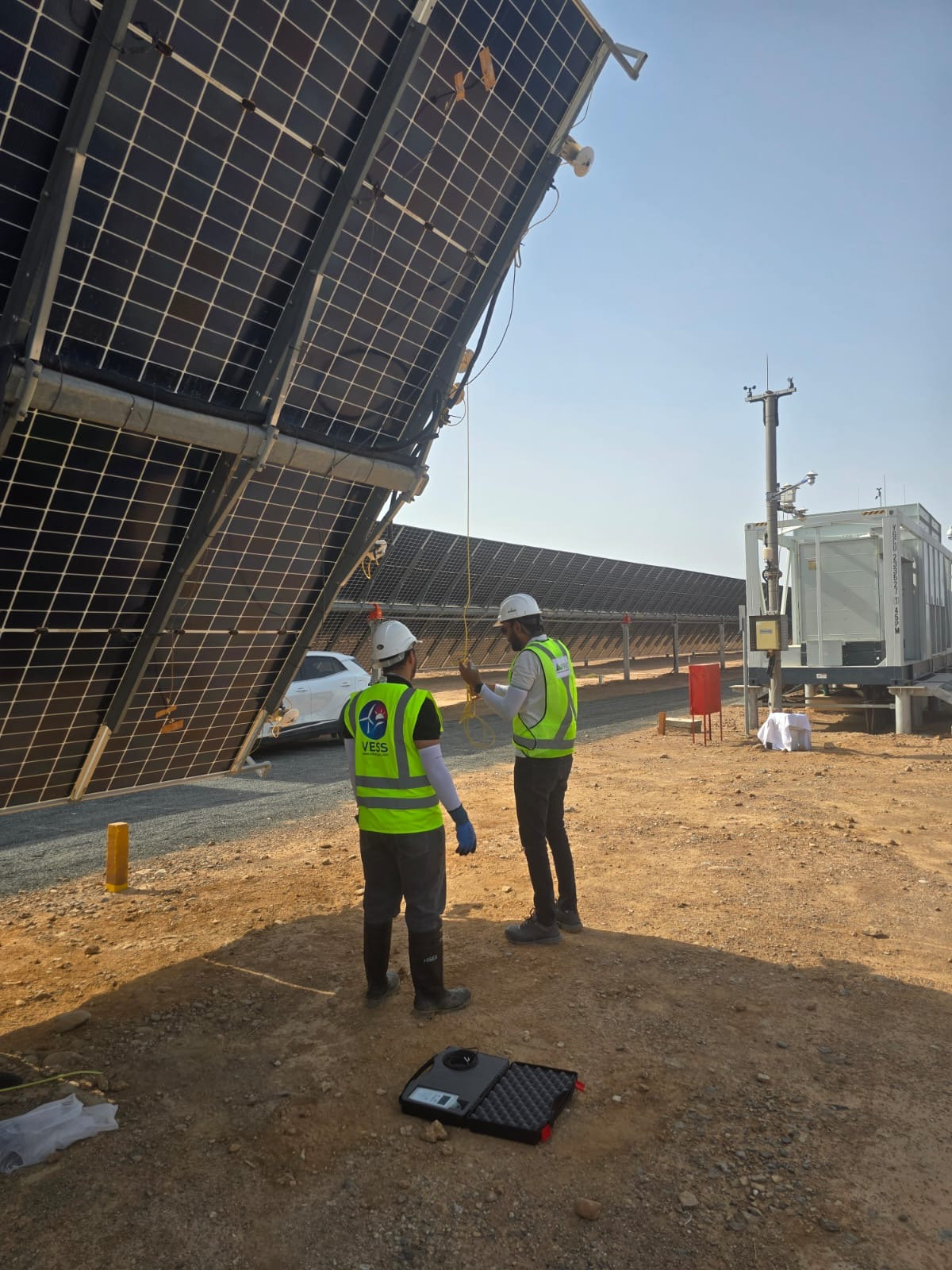 Engineers reviewing technical due diligence documents for an energy project